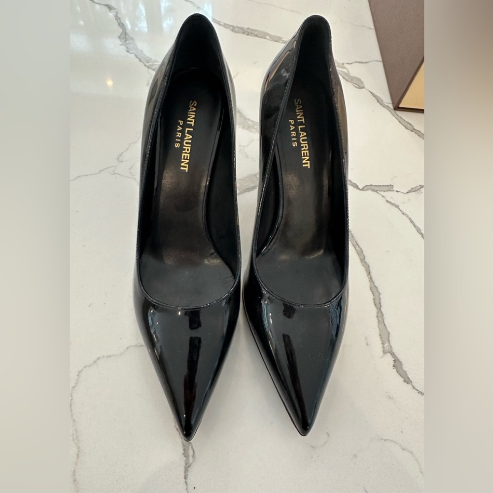 Brand new Saint Laurent patent pumps. Never worn.